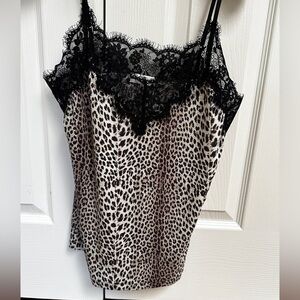 Top leopard and black lace. Size Small but fits more like size Medium.